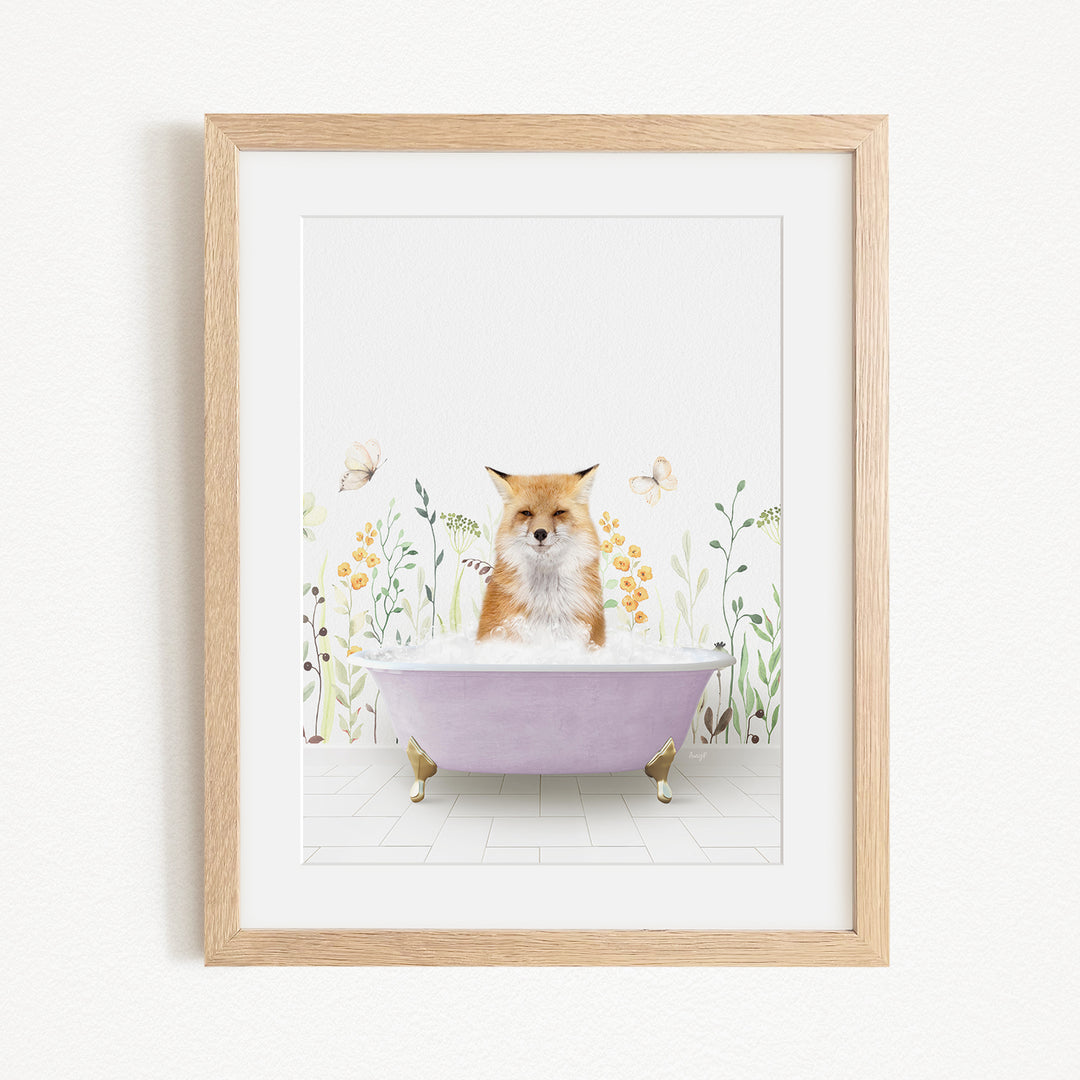 A framed print depicting a fox sitting in a bathtub filled with water, surrounded by flowers and butterflies.