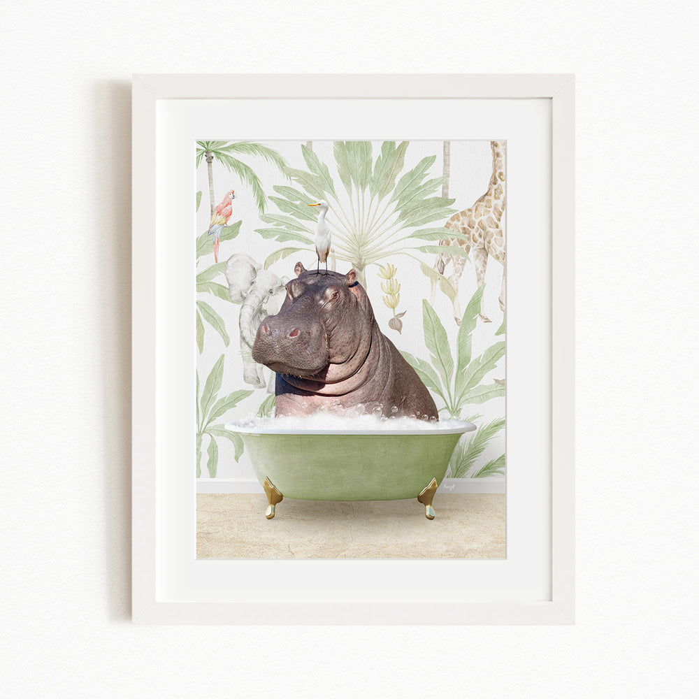 A framed image depicting a hippopotamus sitting in a green bathtub, surrounded by tropical foliage and other animals.
