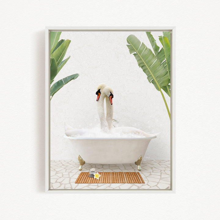 A pair of swans sitting in a white bathtub, surrounded by green leaves, creating a serene and relaxing scene.