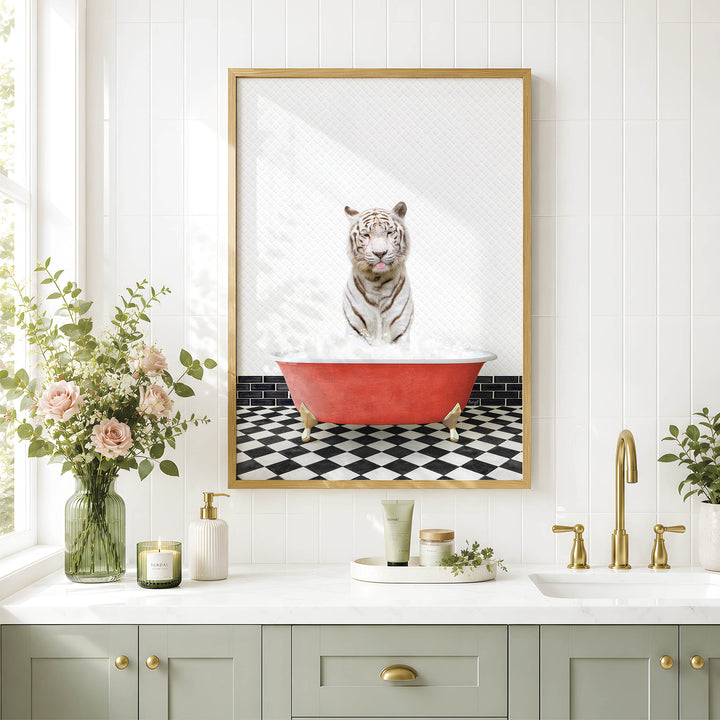 a bathroom with a framed picture of a tiger sitting in a red bathtub, surrounded by a black and white checkered floor and white tiles.