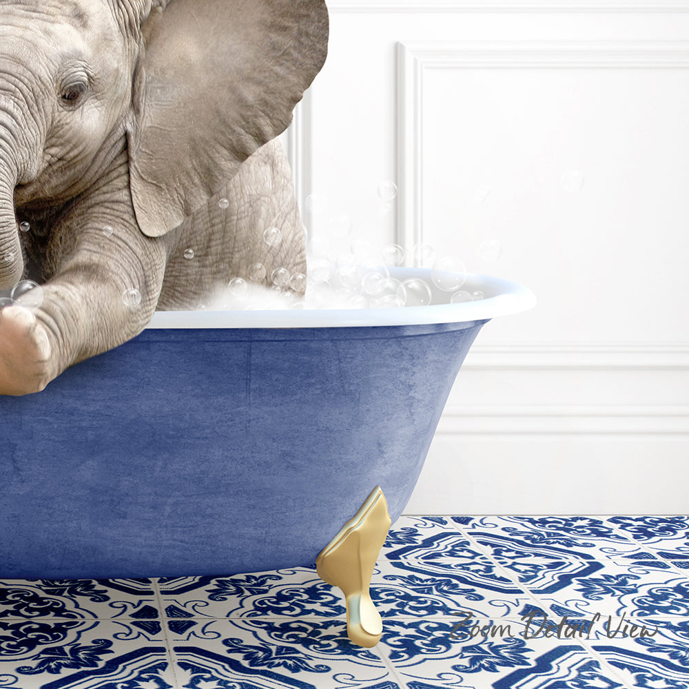A baby elephant is sitting in a blue bathtub filled with bubbles, surrounded by a blue and white patterned floor.