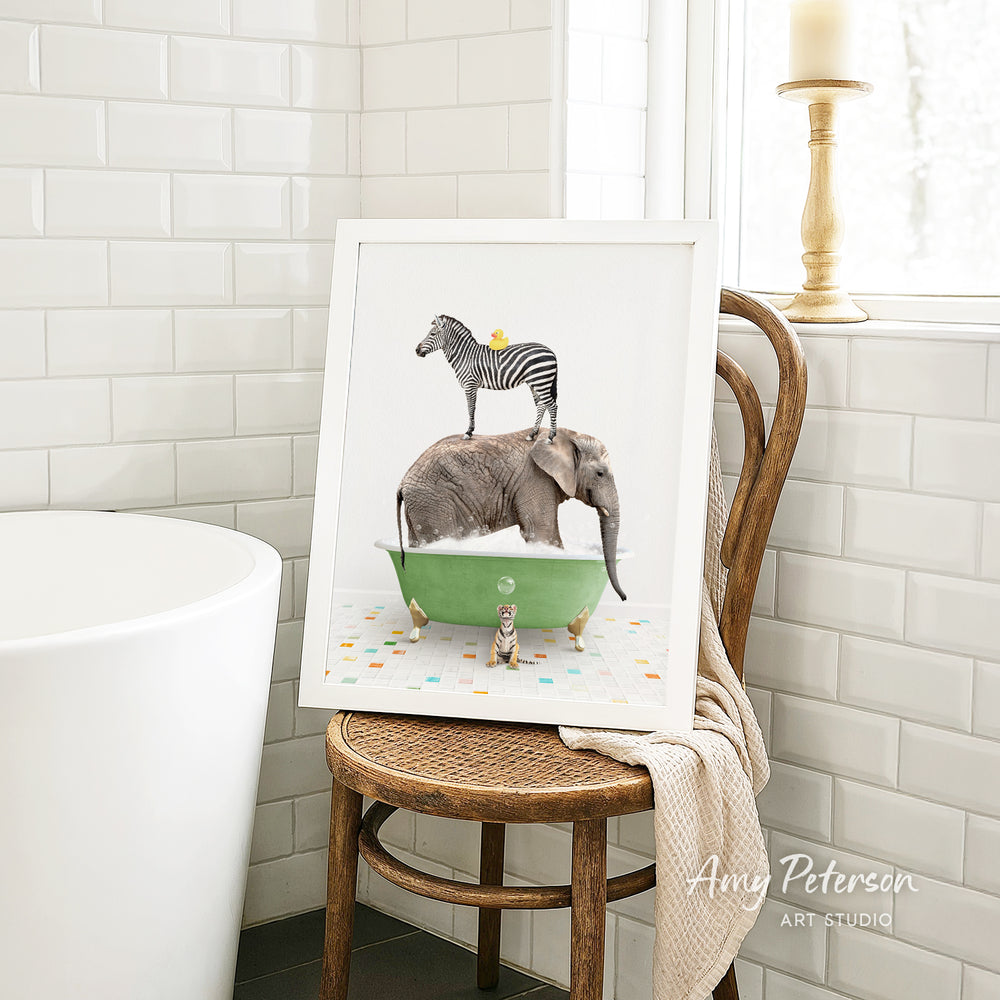 A framed image depicting a zebra standing on an elephant's back while both animals are in a green bathtub, surrounded by colorful tiles.