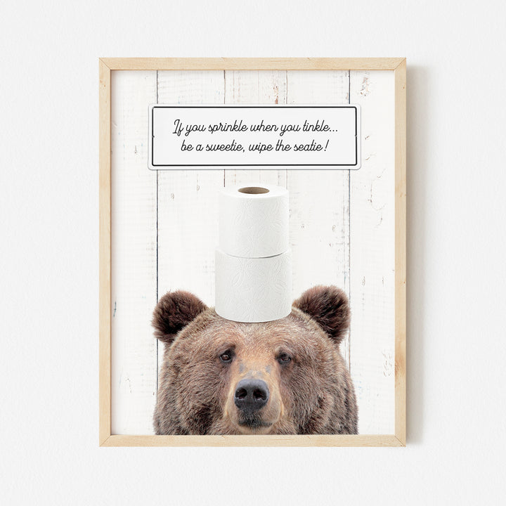 a picture of a bear with a roll of toilet paper on its head