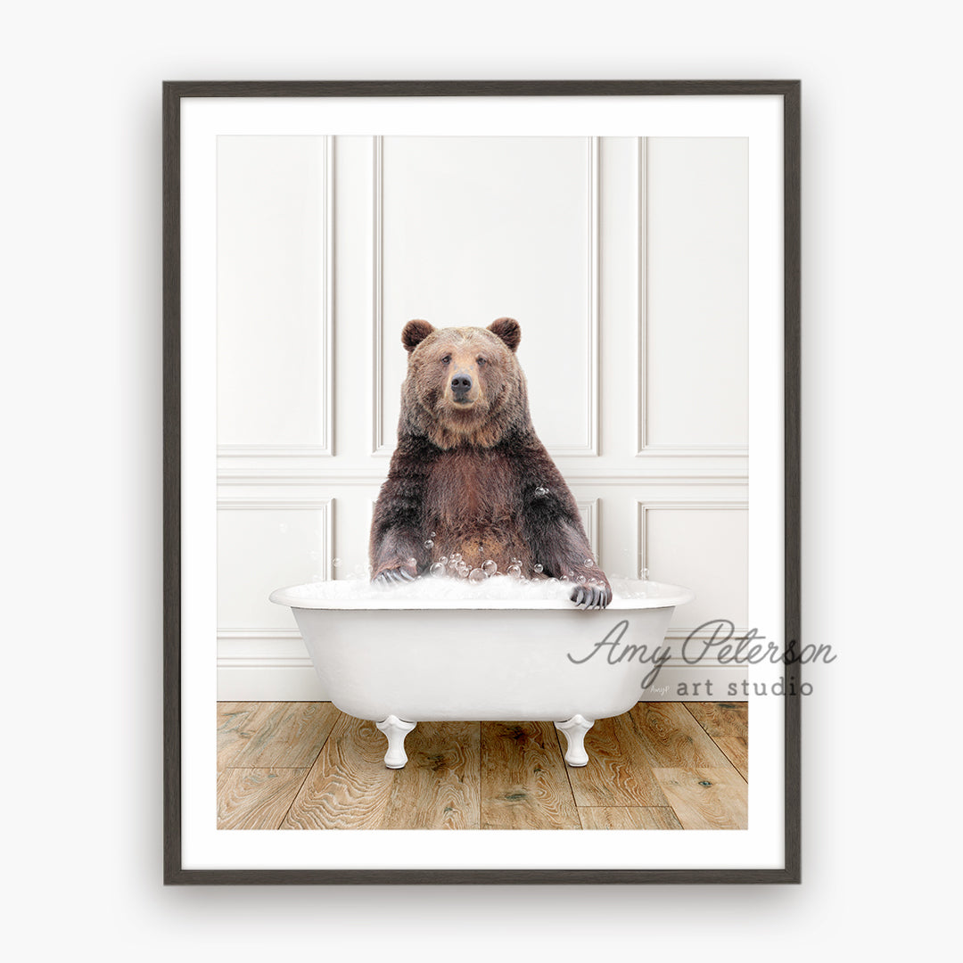 a brown bear sitting in a bath tub