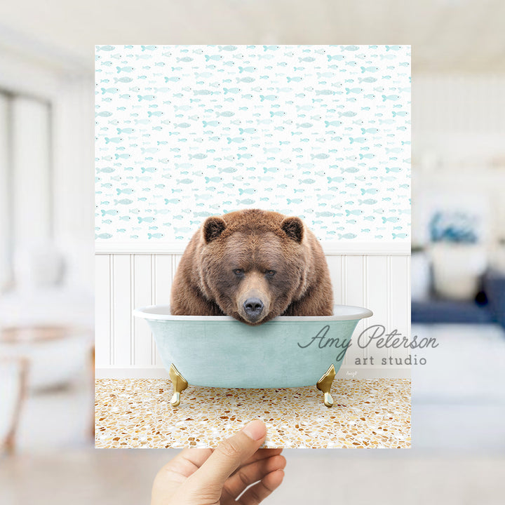 a brown bear sitting in a blue bath tub