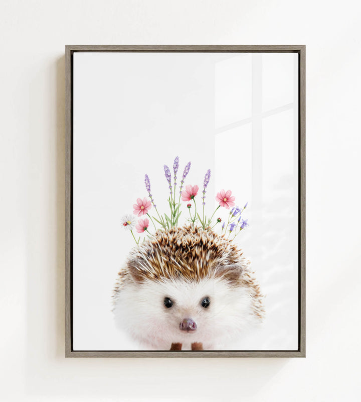 A framed print of a hedgehog with flowers on its head.