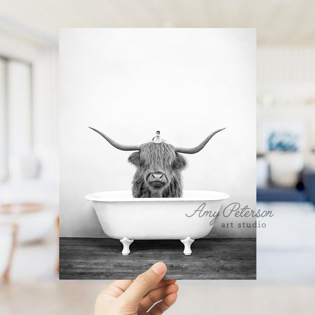 a black and white photo of a bull in a bathtub