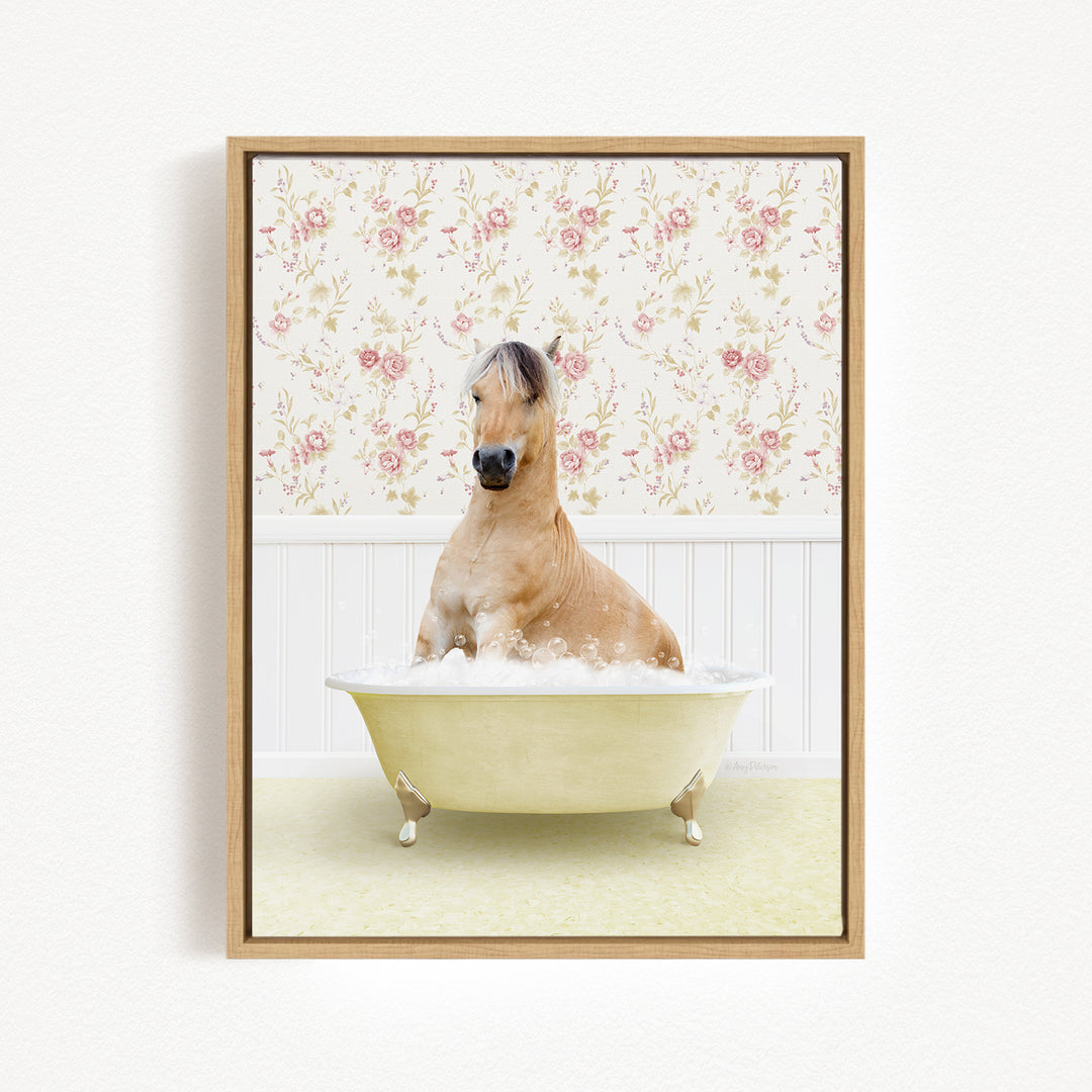 A brown horse sitting in a white bathtub filled with bubbles, surrounded by a floral wallpaper.