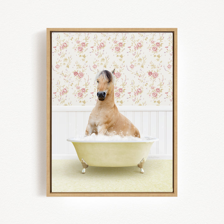 A brown horse sitting in a white bathtub filled with bubbles, surrounded by a floral wallpaper.