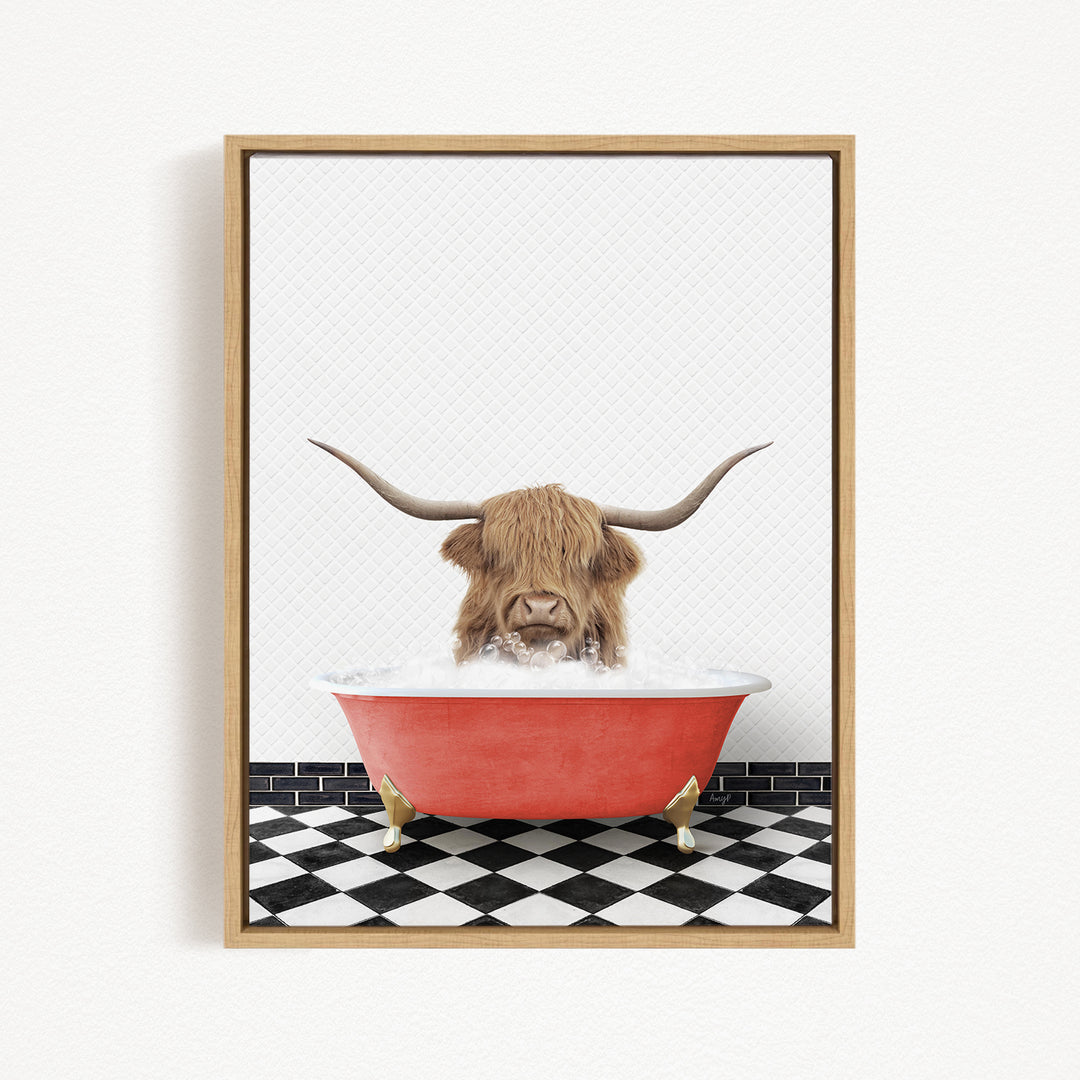 A Highland cow with long horns is sitting in a red bathtub filled with water, creating a whimsical and playful scene.