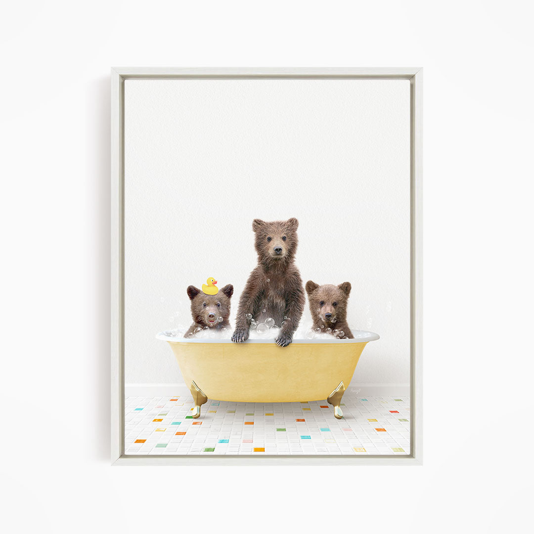 A framed image depicting three bears sitting in a yellow bathtub, with one bear sitting in the center and two bears sitting on either side.