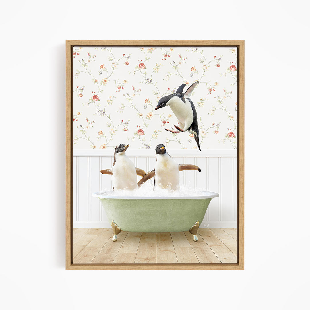 A framed image depicting two penguins sitting in a green bathtub, with one penguin flying towards the other.