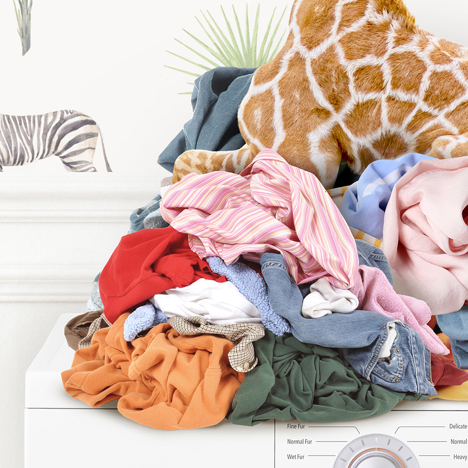 a pile of clothes sitting on top of a dryer