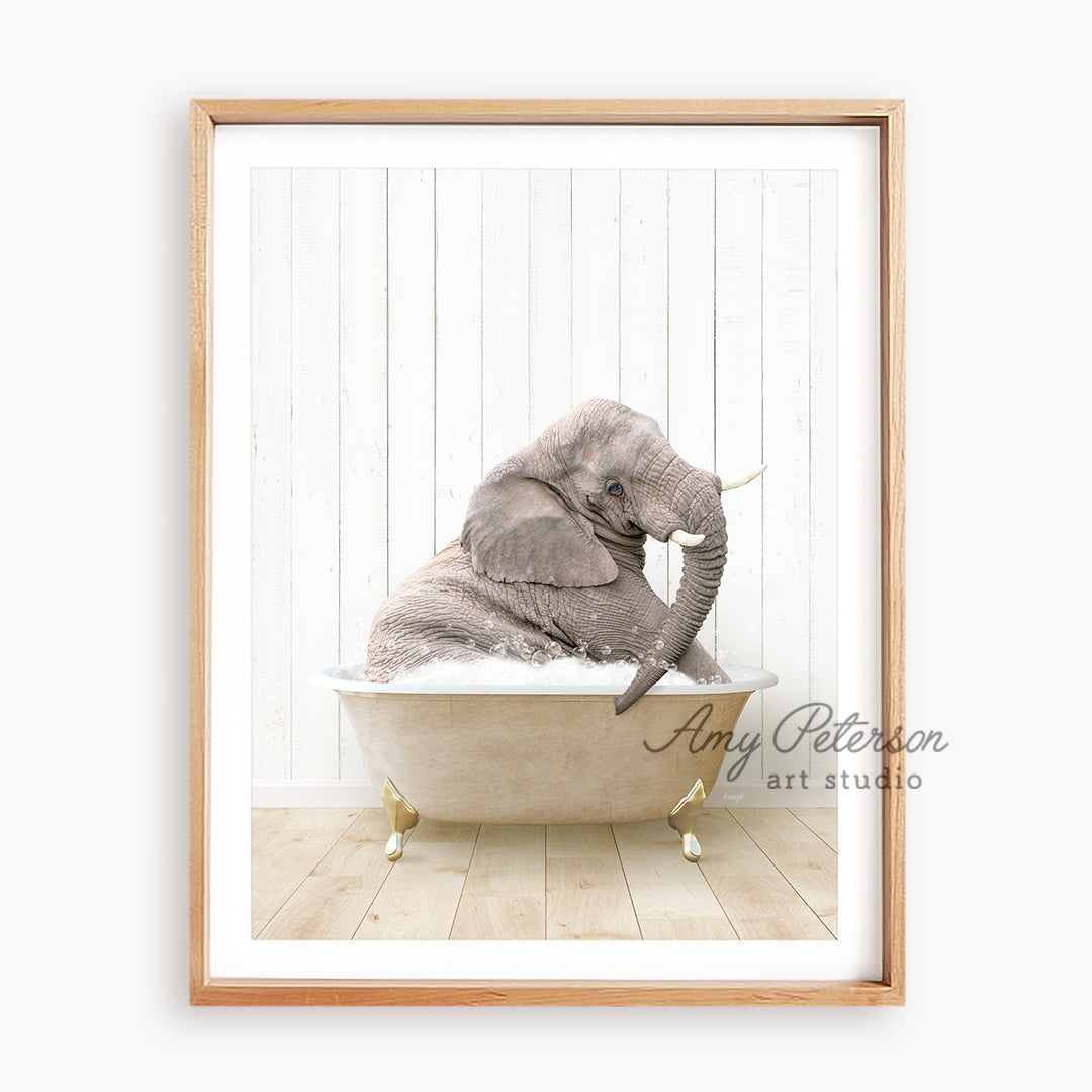 an elephant sitting in a bathtub with its trunk in the air