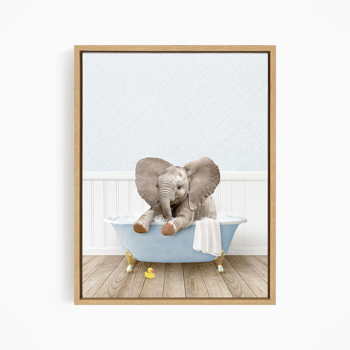 A baby elephant sitting in a blue bathtub filled with water, surrounded by rubber ducks.