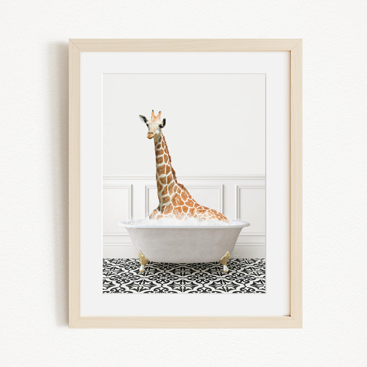A giraffe sitting in a white bathtub filled with bubbles, creating a whimsical and playful scene.