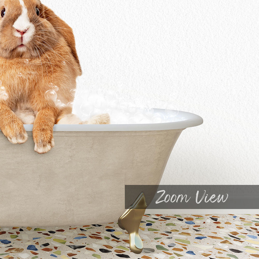 A cute orange rabbit sitting in a bathtub filled with bubbles, with a mosaic floor in the foreground.
