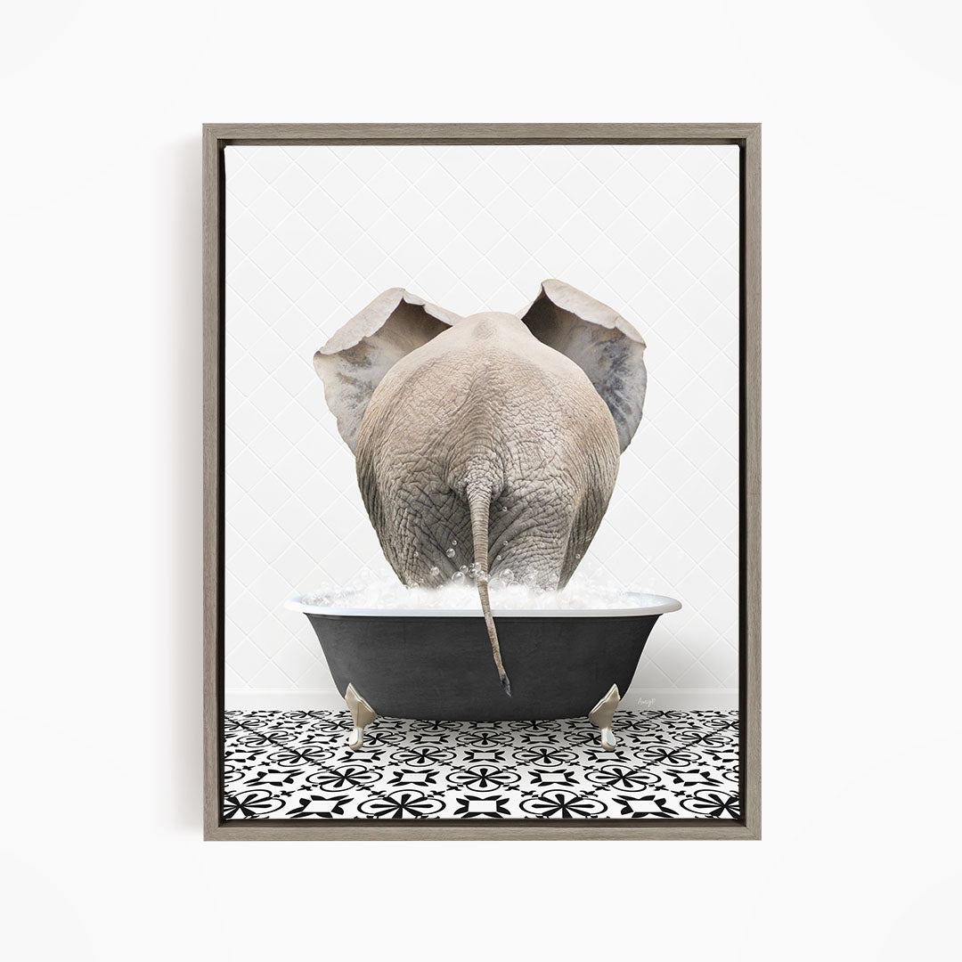 A gray elephant is standing in a black bathtub filled with water, with its trunk submerged in the water.
