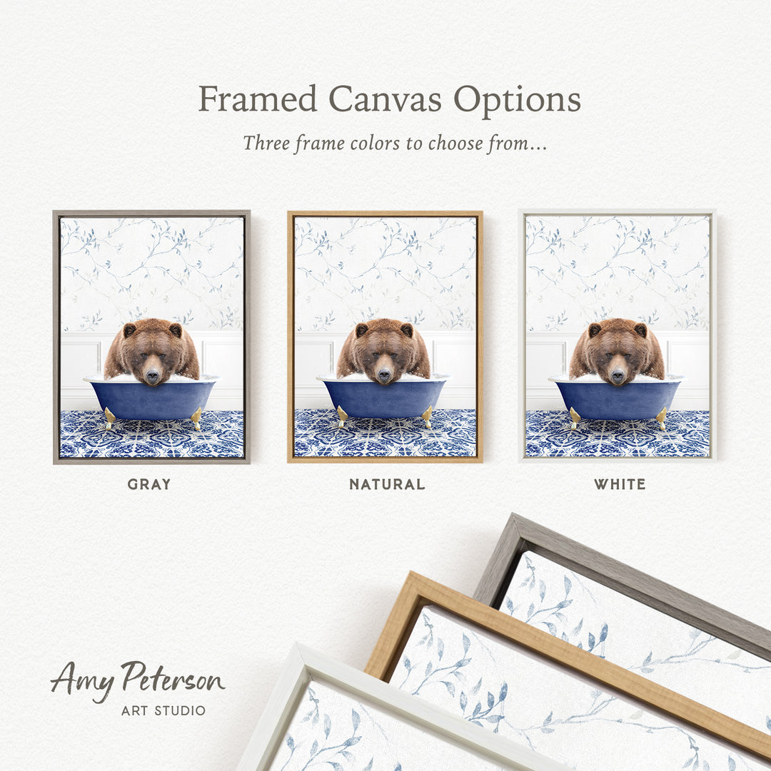 The image is a framed canvas option showcasing three different framed canvas options, each featuring a brown bear sitting in a blue tub. The options include a gray frame, a natural frame, and a white frame.