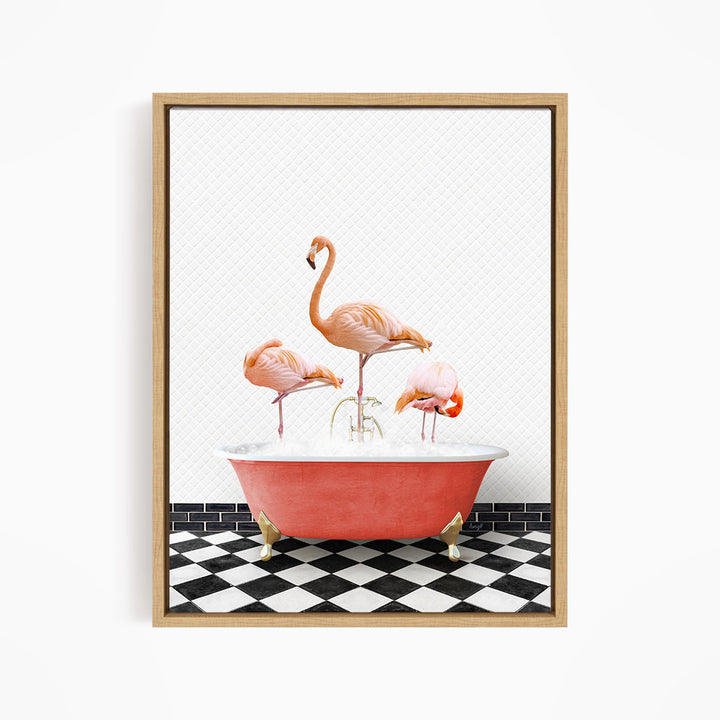 A framed image depicting three flamingos standing in a pink bathtub filled with water, set against a black and white checkered floor.