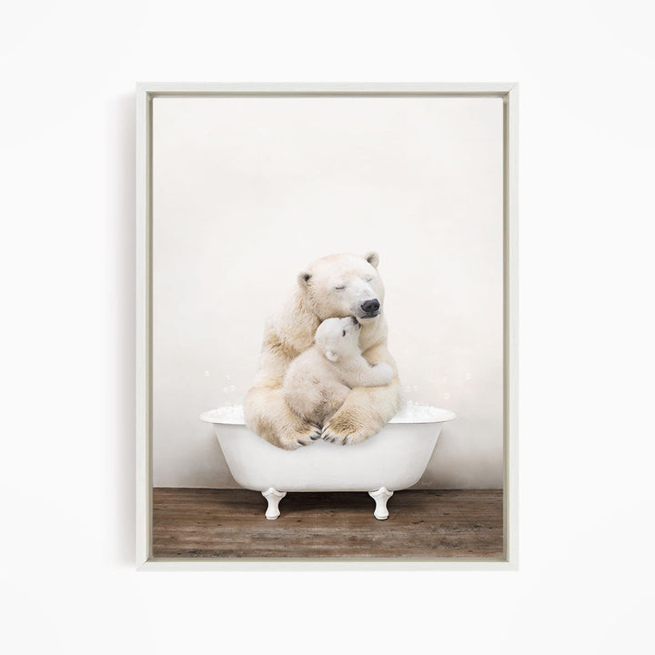 A mother polar bear tenderly embracing her cub in a white bathtub against a plain white background.