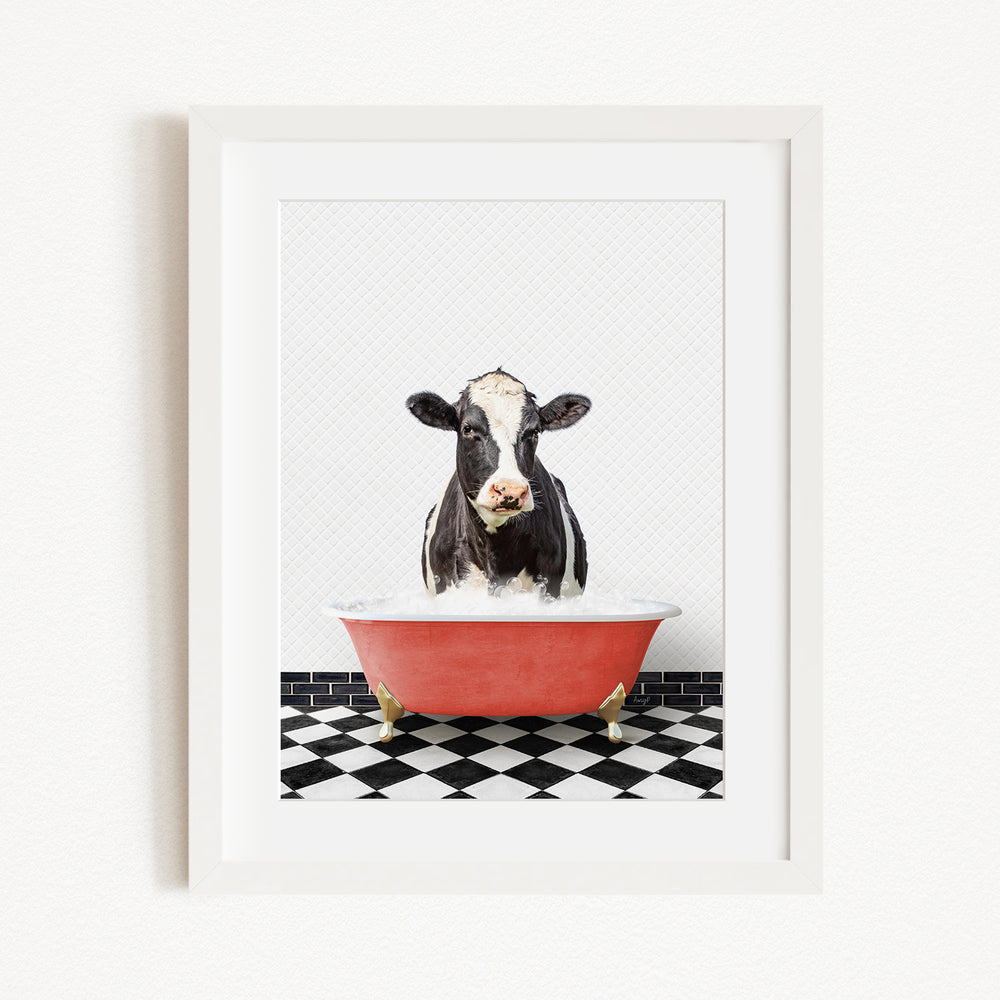 A black and white cow is sitting in a red bathtub filled with water, creating a whimsical and humorous scene.