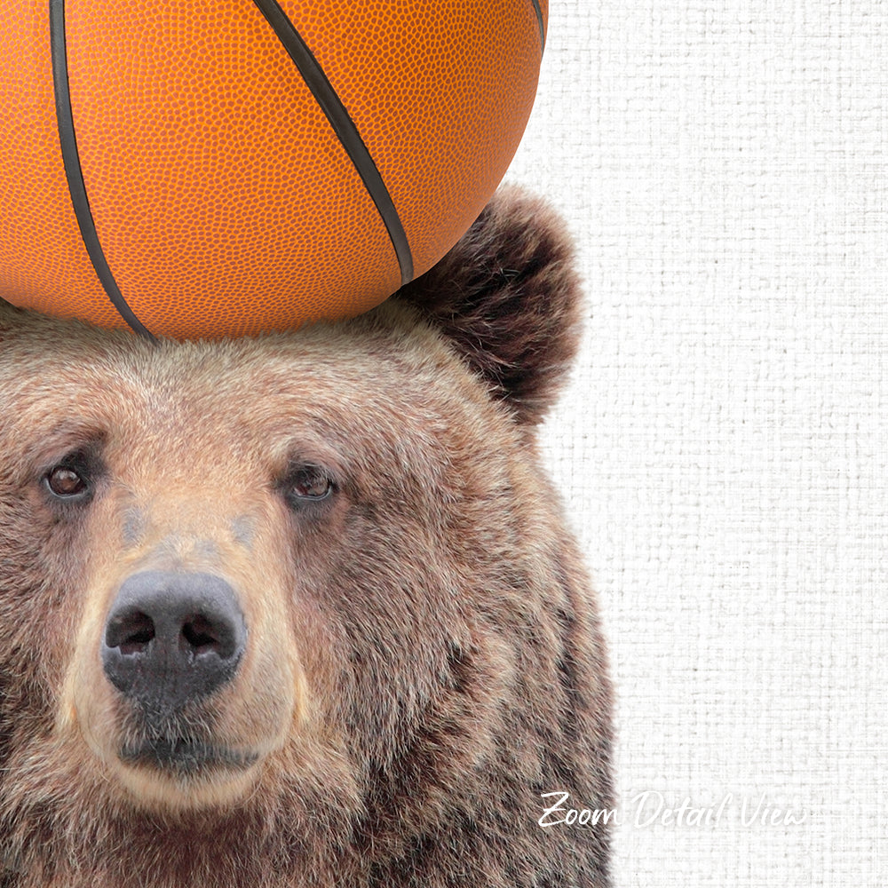A close-up of a brown bear with a basketball resting on its head.