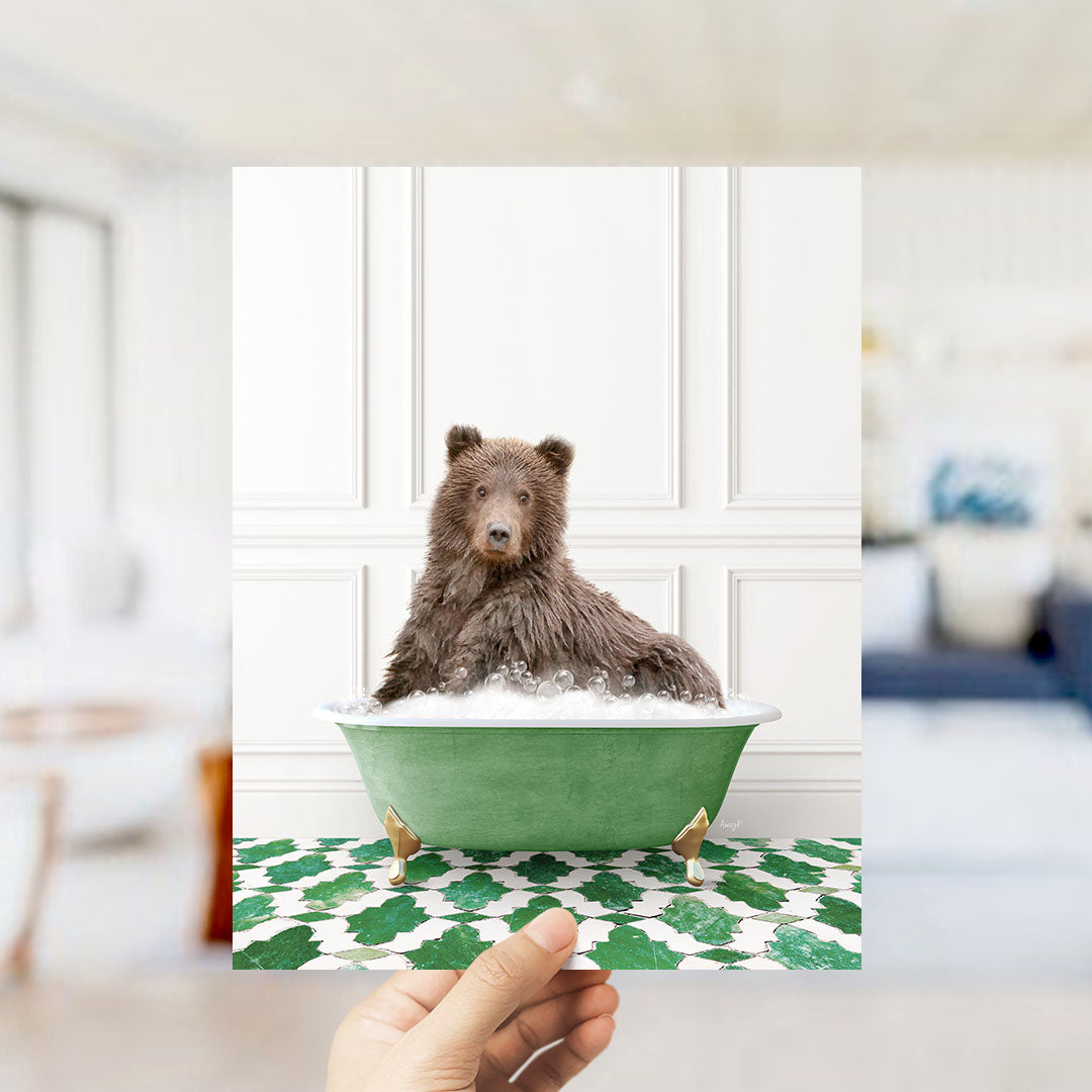 A brown bear sitting in a green bathtub filled with bubbles, surrounded by a patterned floor.