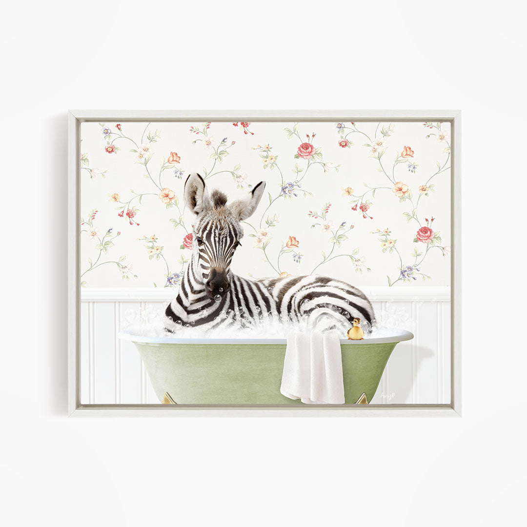 A zebra is sitting in a green bathtub, surrounded by a floral wallpaper.