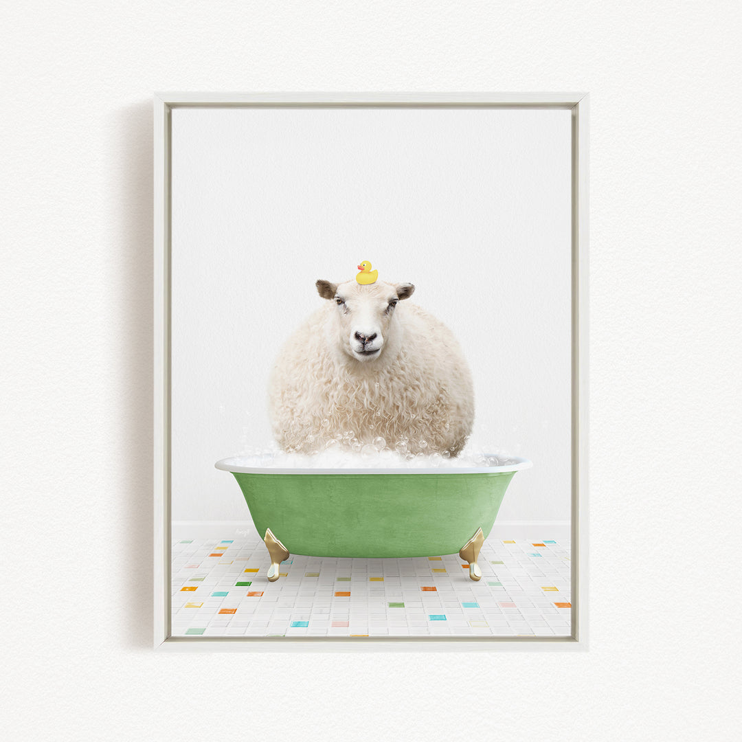 A fluffy white sheep sits in a green bathtub filled with bubbles, with a yellow rubber duck perched on its head.