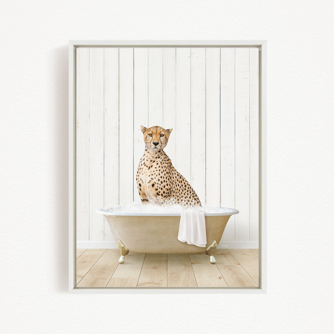A cheetah sitting in a bathtub filled with water, with a towel draped over the side of the tub.