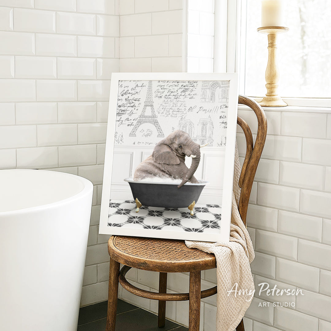A framed image of a cat sitting in a bathtub, surrounded by a tiled bathroom setting.