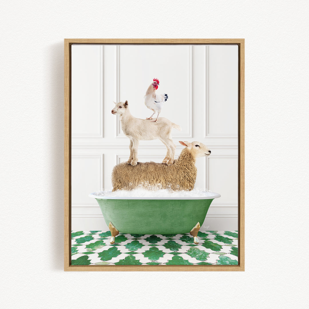 A framed image depicting a white goat standing on a sheep's back, with a rooster perched on top of the sheep, all atop a green bathtub.