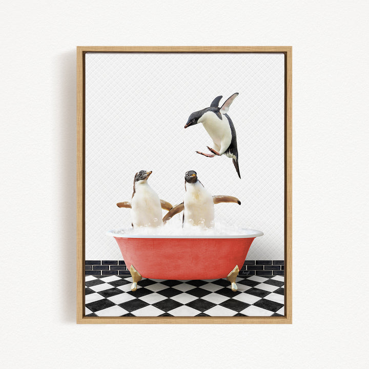 A framed image depicting two penguins sitting in a red bathtub, with one penguin flying towards the other in mid-air.