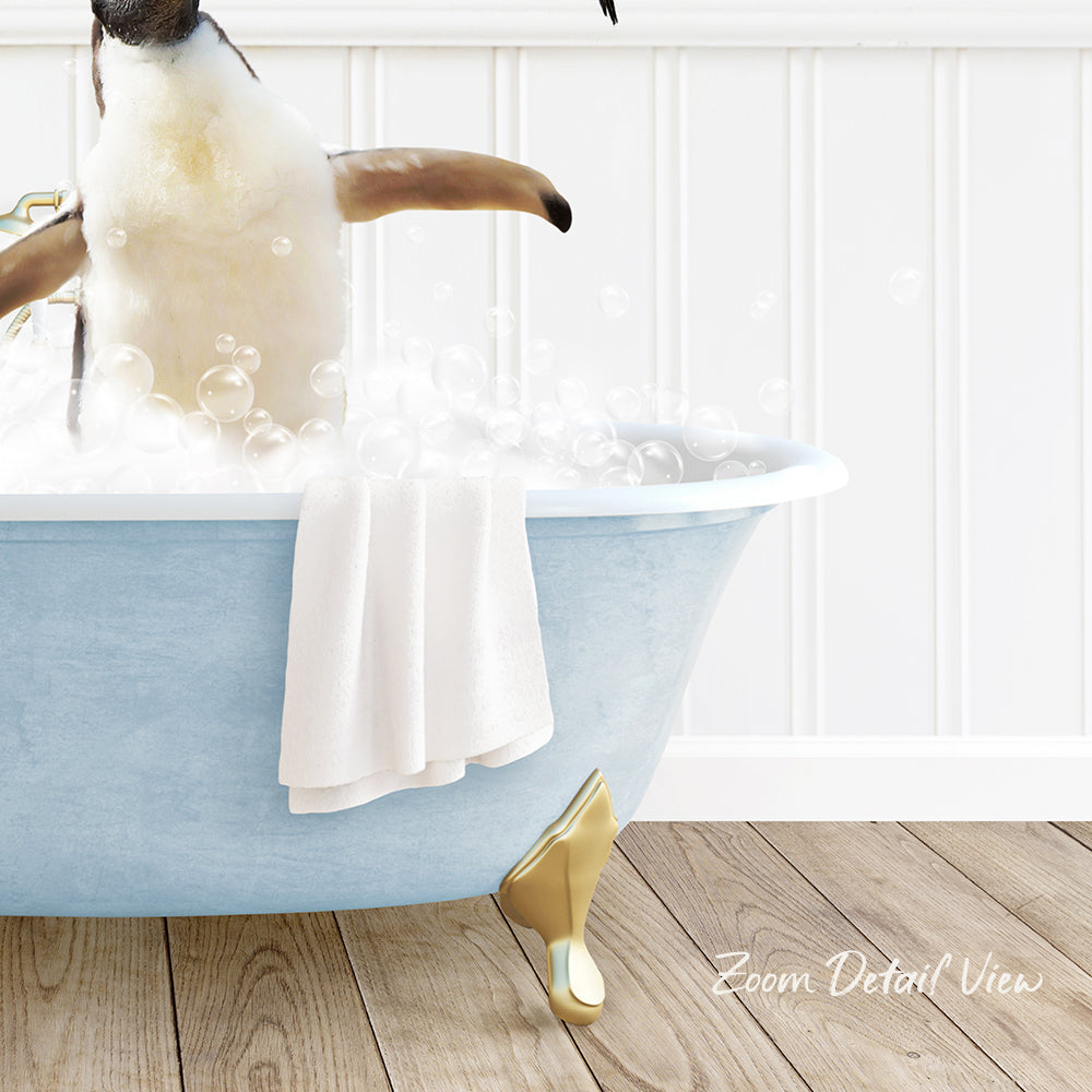 A penguin standing in a blue bathtub filled with bubbles, with a towel and gold shoe visible.