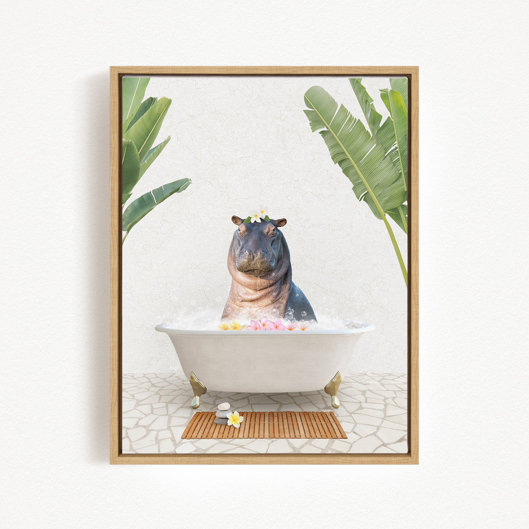 A framed image depicting a hippopotamus sitting in a bathtub filled with bubbles, surrounded by tropical plants and flowers.