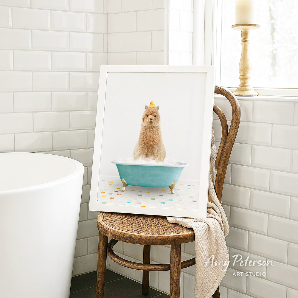 A framed image of a small dog sitting in a blue bathtub filled with bubbles, with a yellow rubber duck perched on its head.