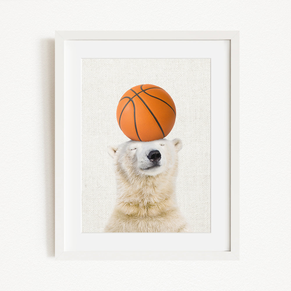 A polar bear balancing a basketball on its head.