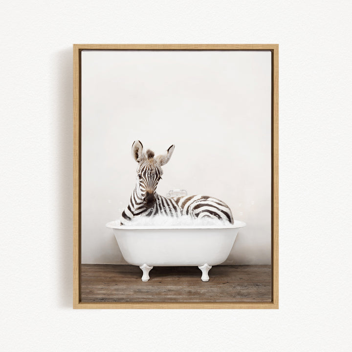 A zebra is sitting in a white bathtub, surrounded by bubbles, creating a whimsical and playful scene.