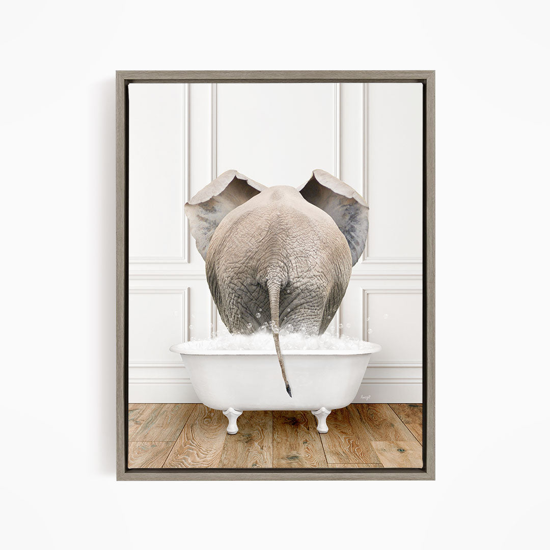 A gray elephant is standing in a white bathtub filled with water, with its trunk submerged in the water.