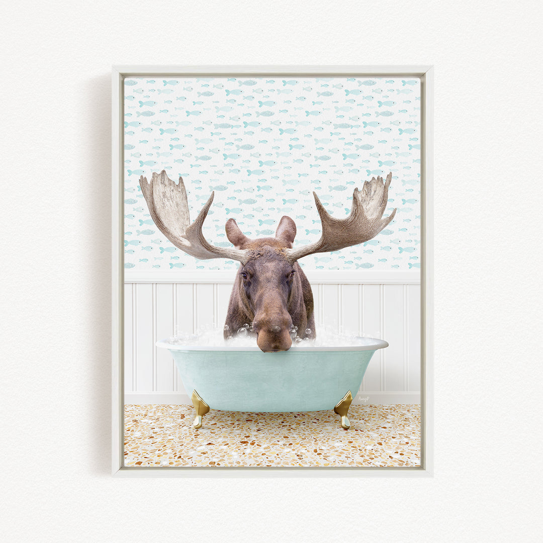 A moose with large antlers is sitting in a bathtub filled with water, surrounded by a pattern of fish.