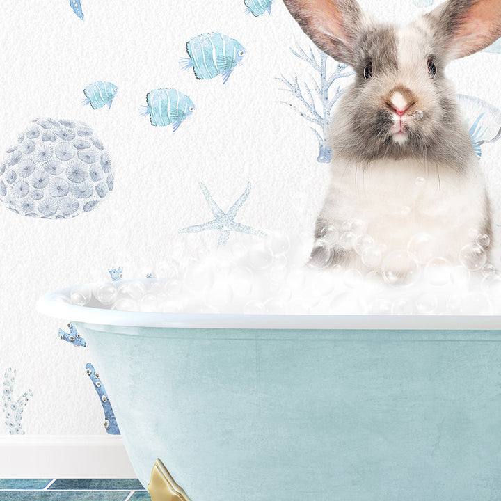 a rabbit is sitting in a bathtub with bubbles