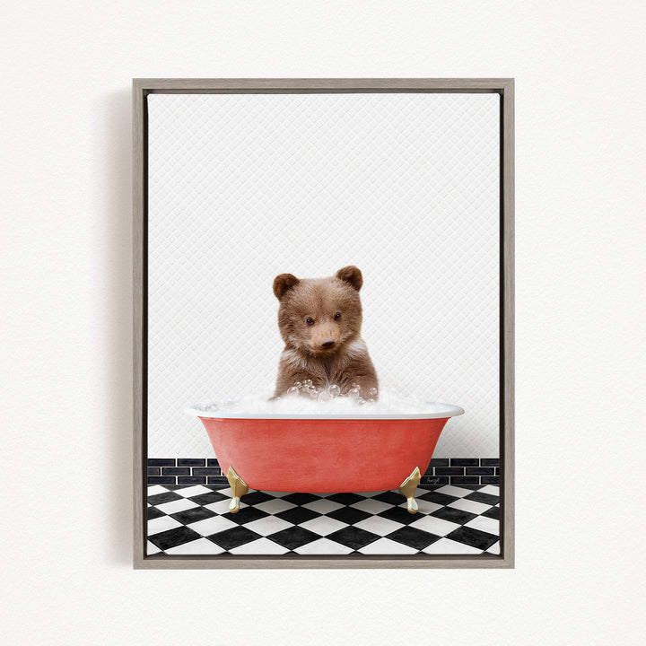 A cute brown bear sitting in a red bathtub filled with bubbles, surrounded by a black and white checkered floor.
