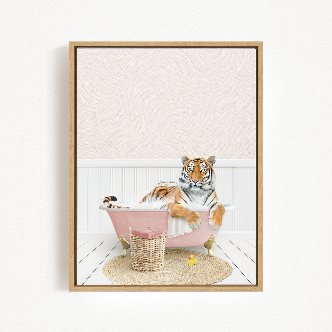 A tiger is sitting in a pink bathtub, surrounded by a basket of toys and a yellow rubber duck, creating a whimsical and playful scene.