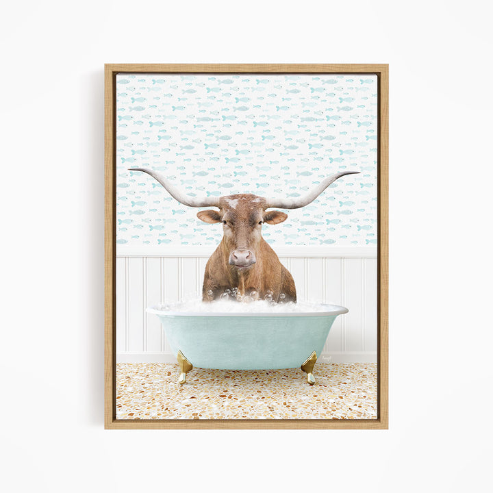 A brown steer with large horns is sitting in a light blue bathtub filled with water, surrounded by a patterned wall.