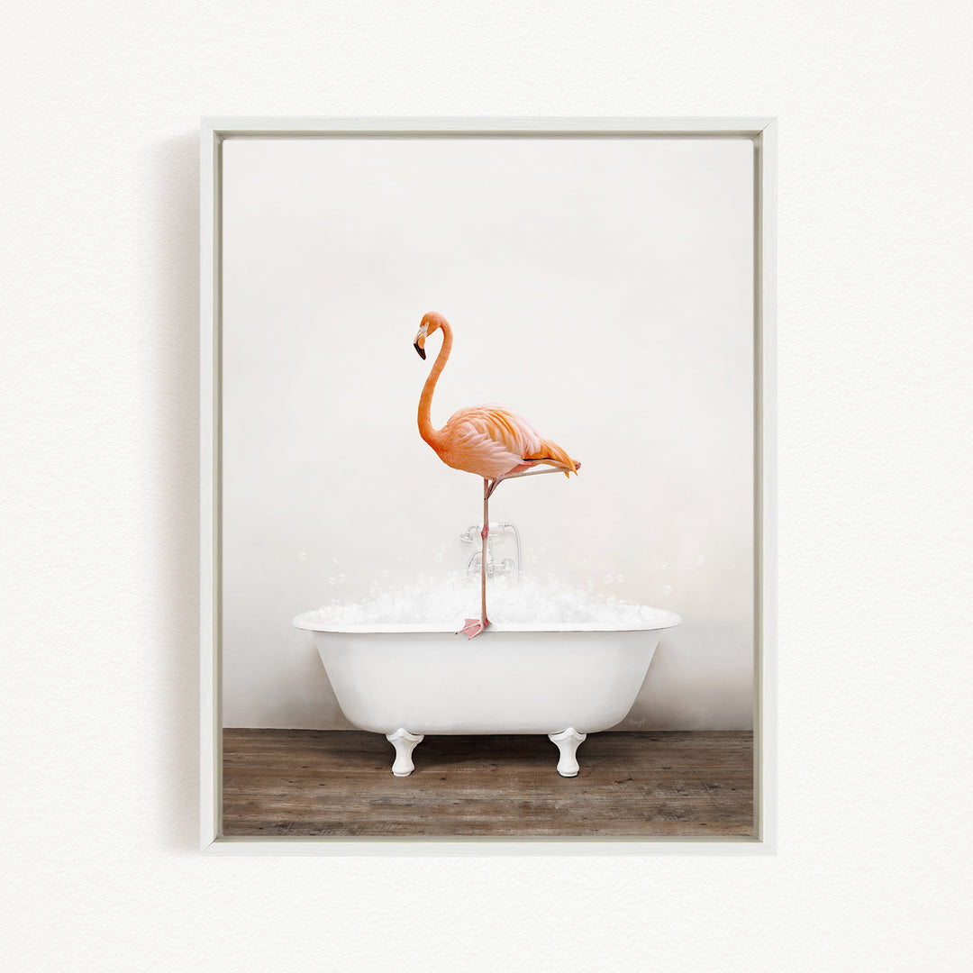 A vibrant orange flamingo stands on the edge of a white bathtub, creating a whimsical and playful scene.