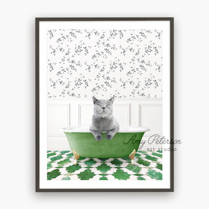 a gray cat sitting in a green bath tub