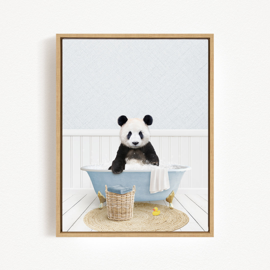 A panda bear sitting in a blue bathtub, surrounded by a basket of toys and a yellow rubber duck.