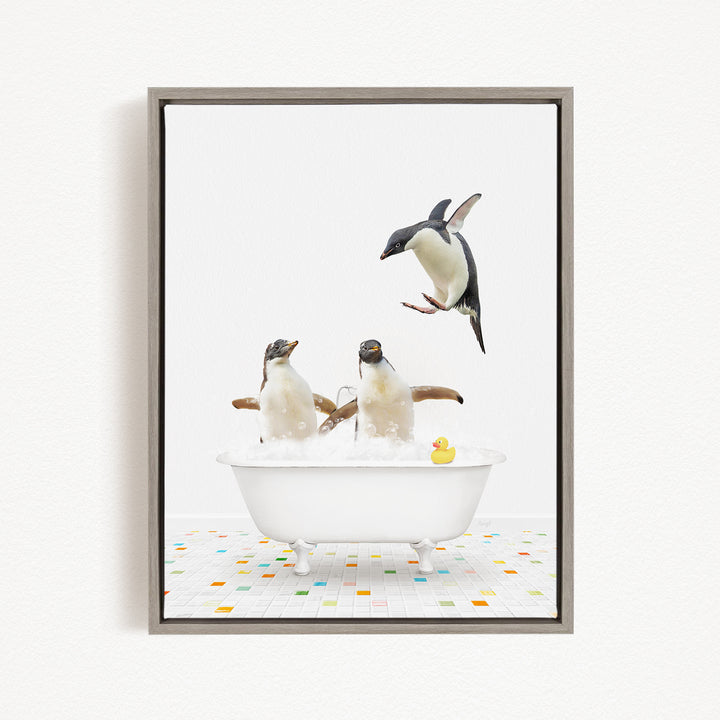 A framed image depicting three penguins sitting in a bathtub, with one penguin flying towards the others.
