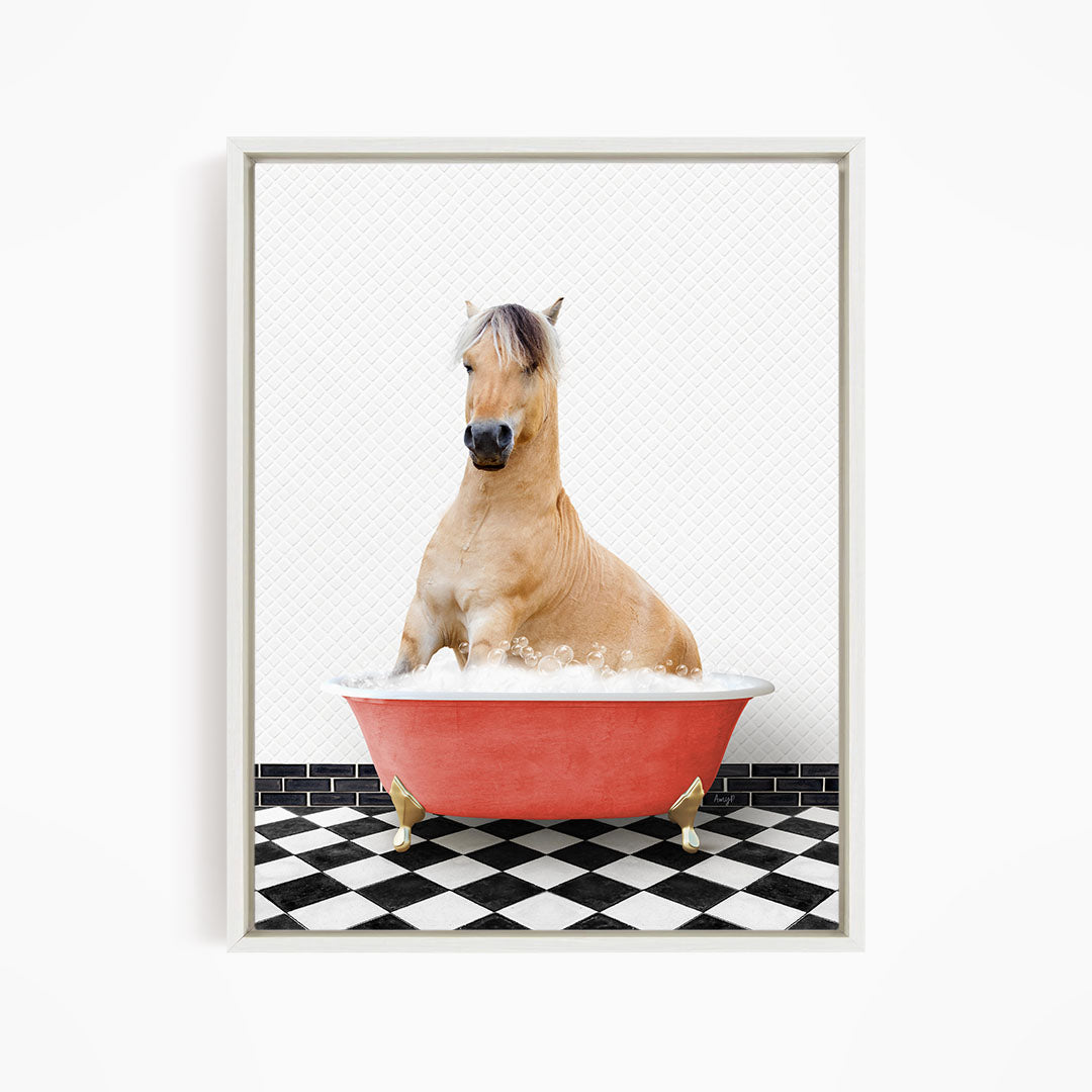 A light brown horse is sitting in a red bathtub filled with water, surrounded by a black and white checkered floor.